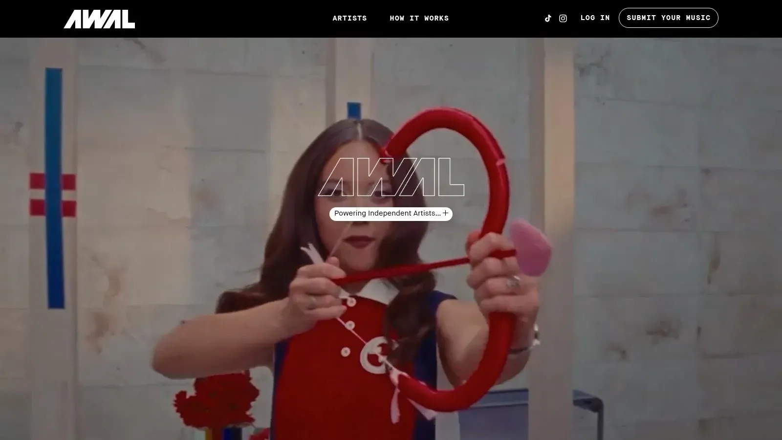 AWAL homepage displaying a video backdrop and the message Powering Independent Artists.